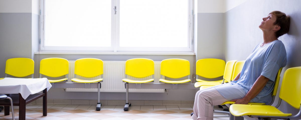 Woman sitting alone in a waiting room