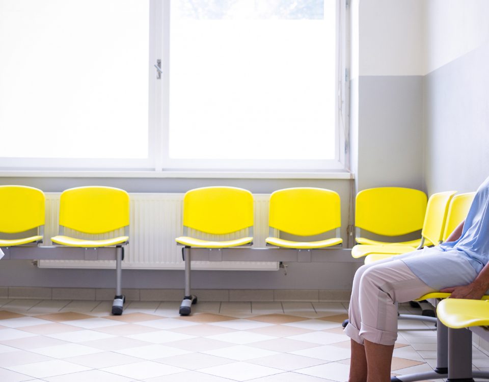 Woman sitting alone in a waiting room
