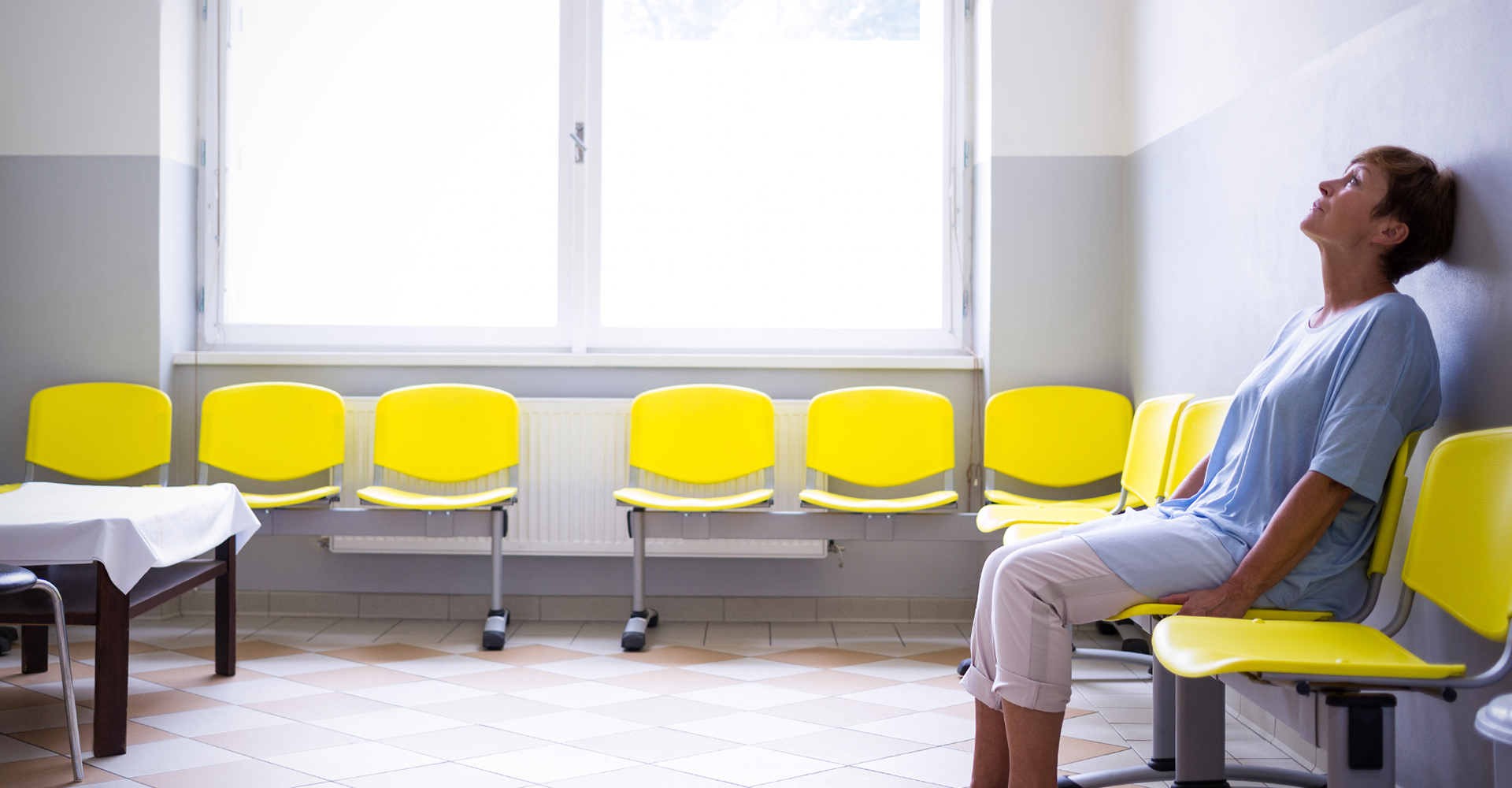 Woman sitting alone in a waiting room